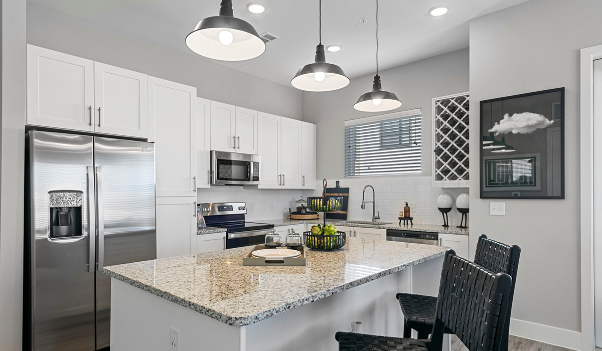 Gin Mill apartment with modern kitchen and dining island.